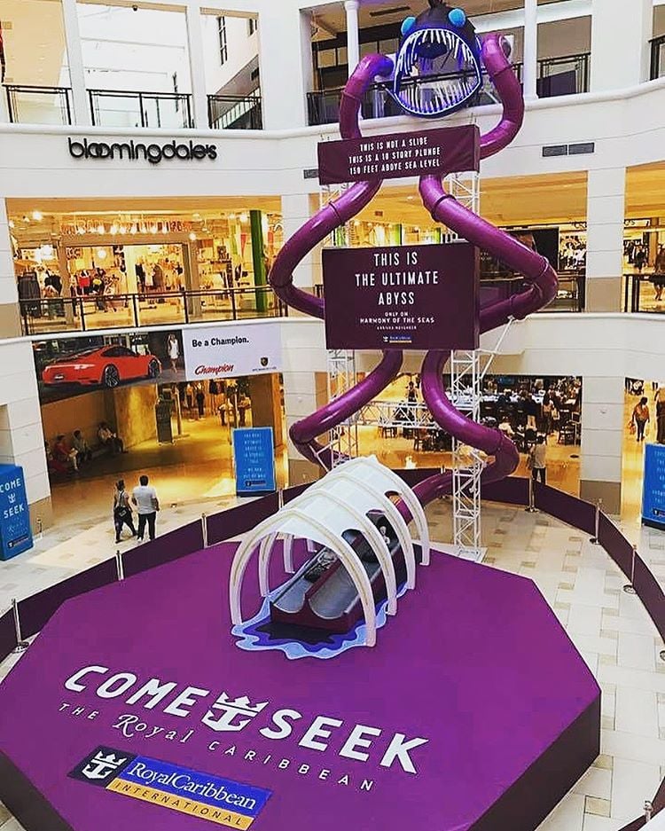 Royal Caribbean Creates Ultimate Abyss Slide In Miami Mall To Promote Harmony Of The Seas