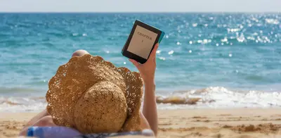 Woman reading her kindle