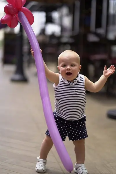 Toddler with a baloon