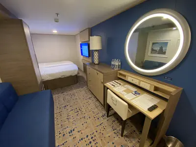 Odyssey of the Seas interior cabin vanity and couch