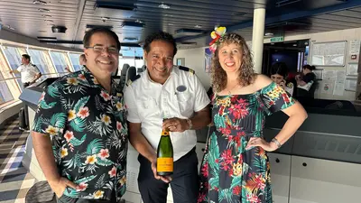 three people smiling in cruise ship bridge