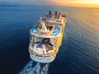 Allure of the Seas aerial with sunset