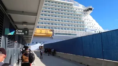 Crew members signing onto Symphony of the Seas