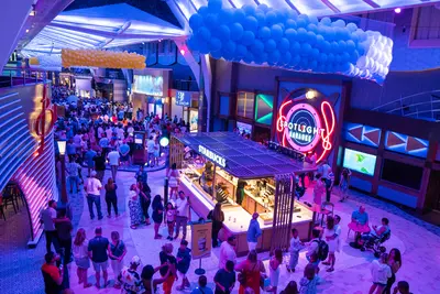 People standing in Royal Promenade of Utopia of the Seas