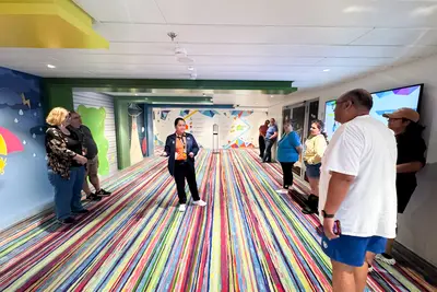 People gathering in escape room on Utopia of the Seas