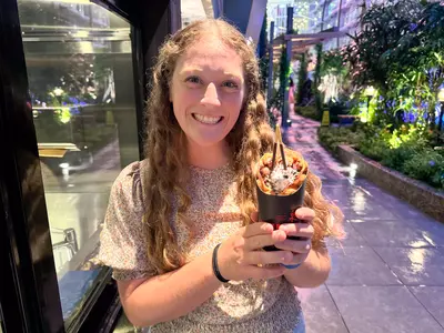 Jenna smiling and holding bubble cone from Izumi