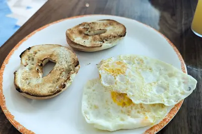 plate of eggs and a bagel