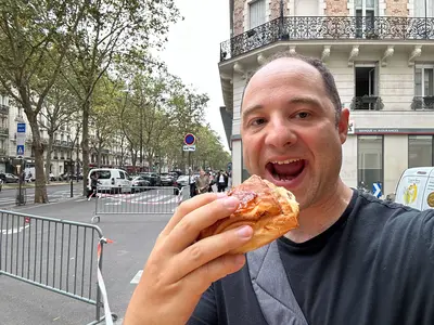 Matt eating a croisssant