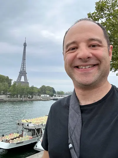 Matt in front of the Eiffel Tower