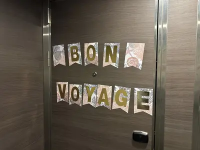 "Bon Voyage" banner on a cruise ship cabin door