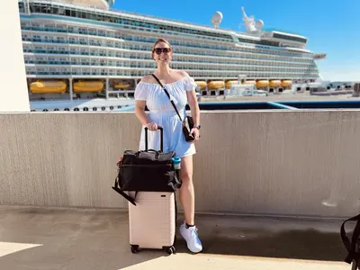 Allie smiling with luggage