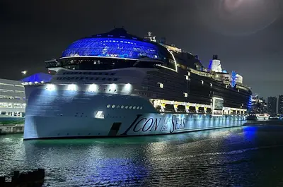 Icon of the Seas docked at night