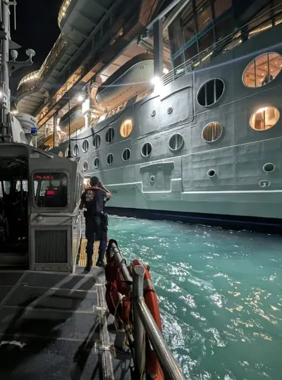 Coast Guard taking passenger off ship