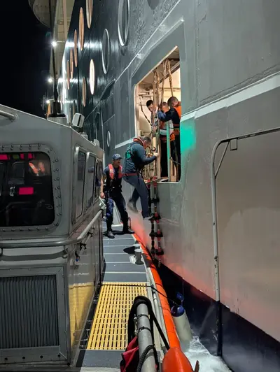 Coast Guard taking passenger off ship