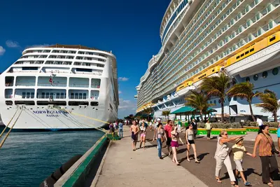 Cruise ship passengers disembark from ship