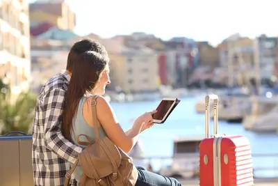 Couple using tablet in Europe