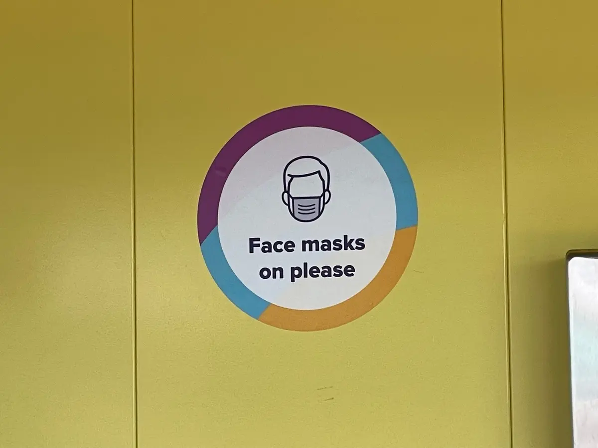 Face masks on please sign