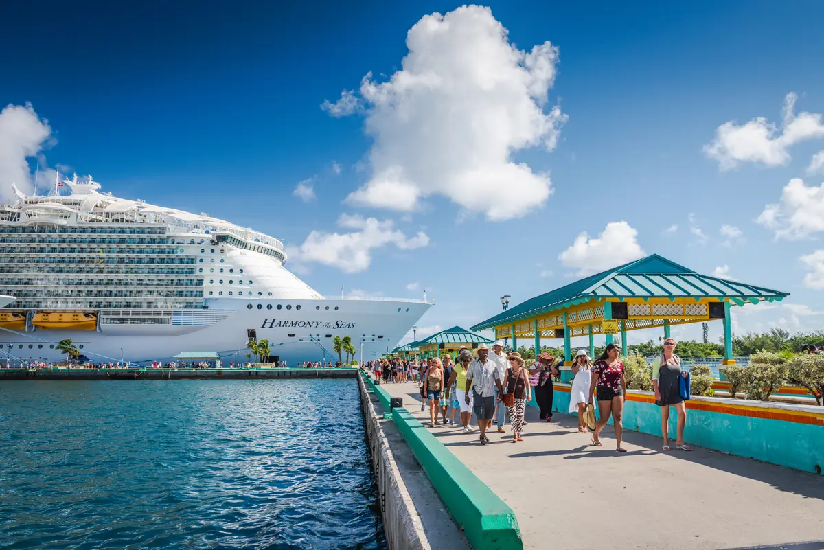 Passengers walking on pier