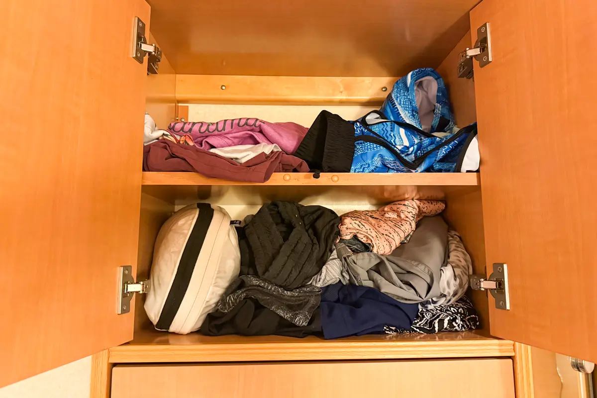 Clothes on shelves in closet