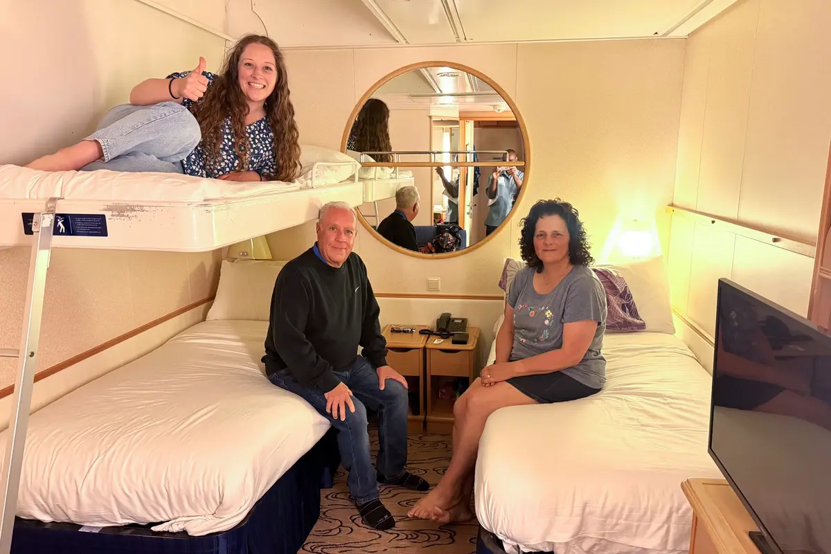 Jenna and her parents in their cruise cabin