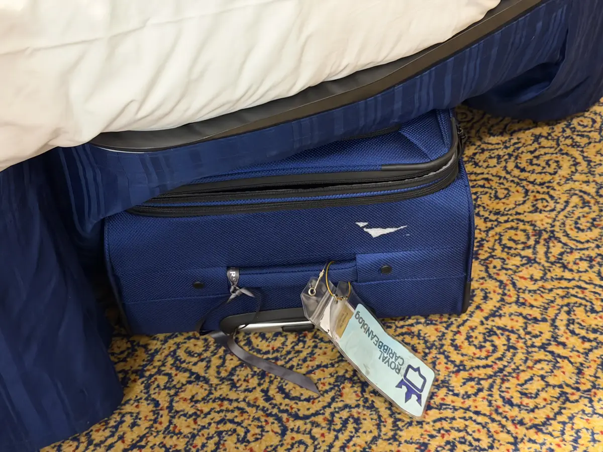 Luggage stored under the bed