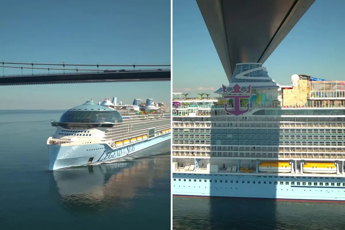 Legend of the Seas passing under bridge