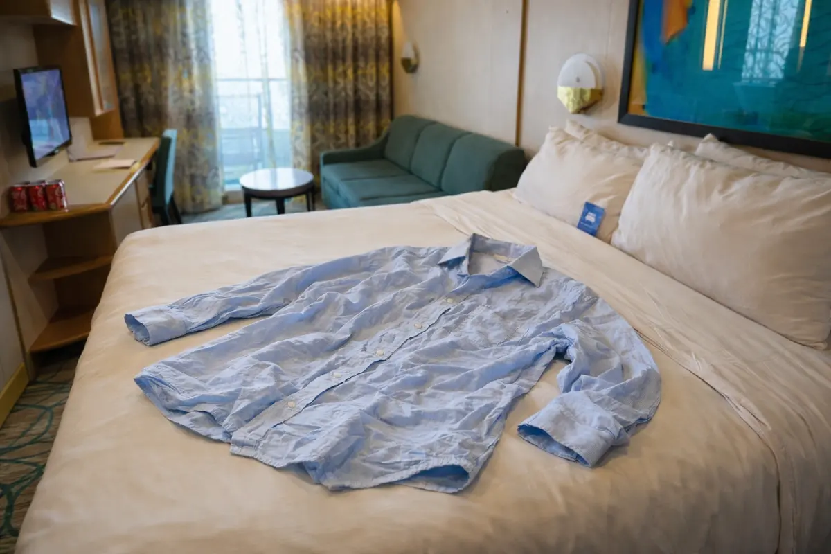 Wrinkled shirt on a bed in a cabin
